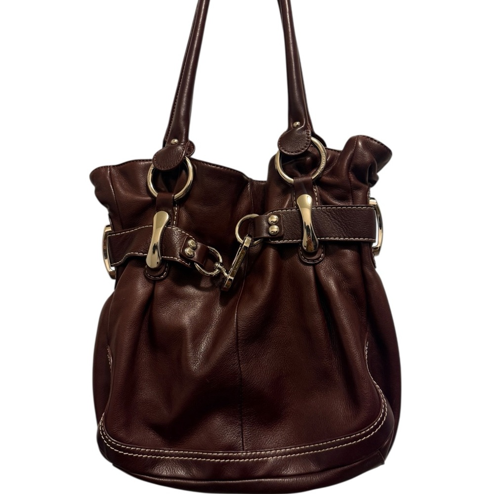B. Makowsky crafted from genuine soft or pebbled leather in a rich brown